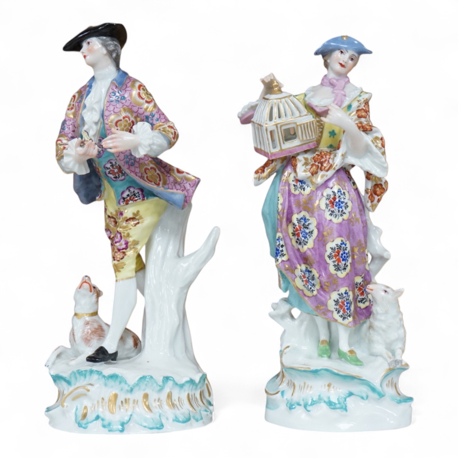A pair of Derby style figures of a lady holding a bird cage and a gentleman holding a bird, tallest 23cm high